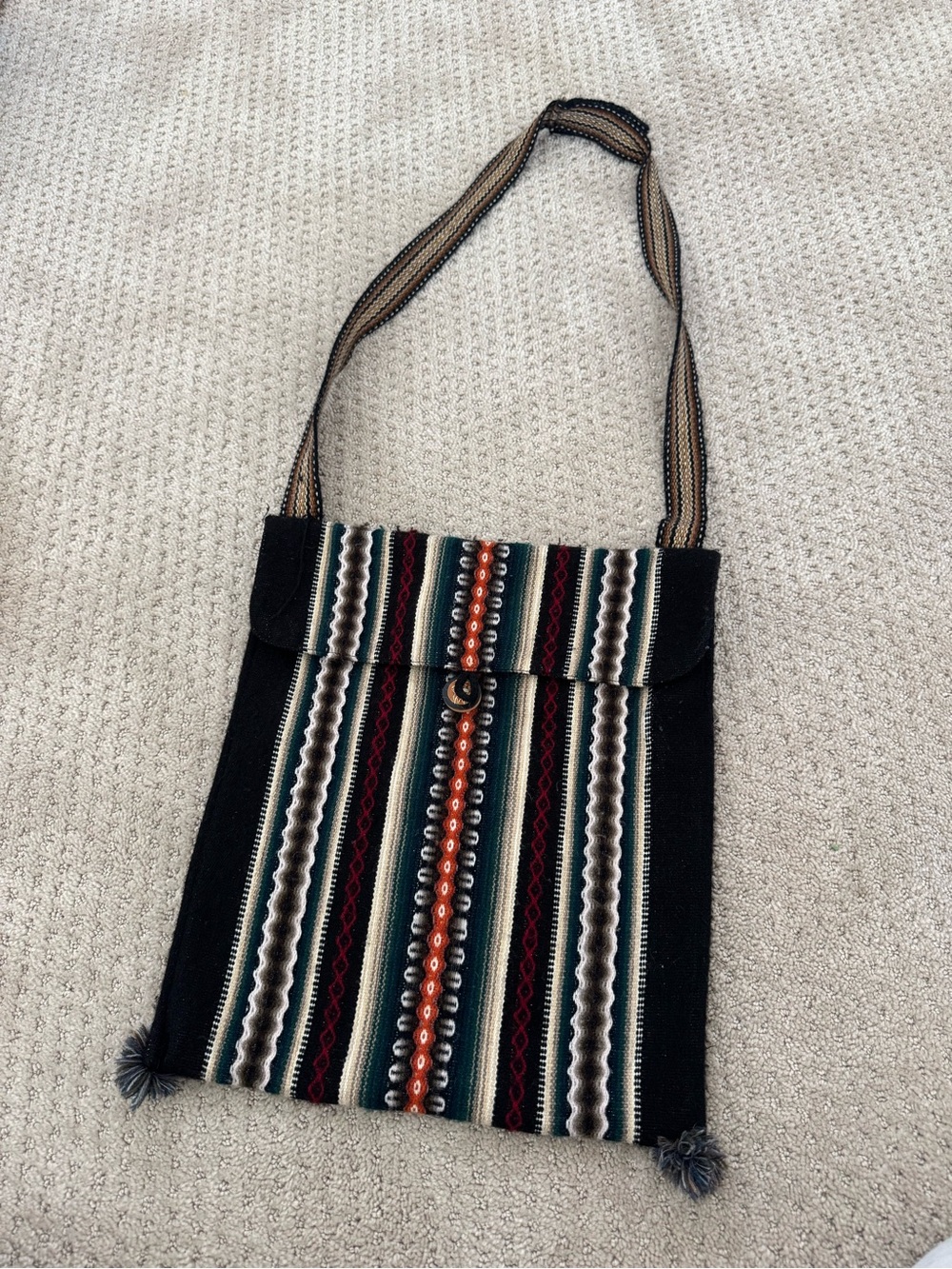 Handwoven Black Striped Crossbody Bag with Beaded Accent
